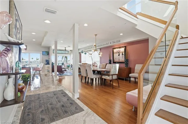 Foyer entrance featuring plenty of natural light, recessed lighting, and light wood-type flooring - Virtually Edited Image