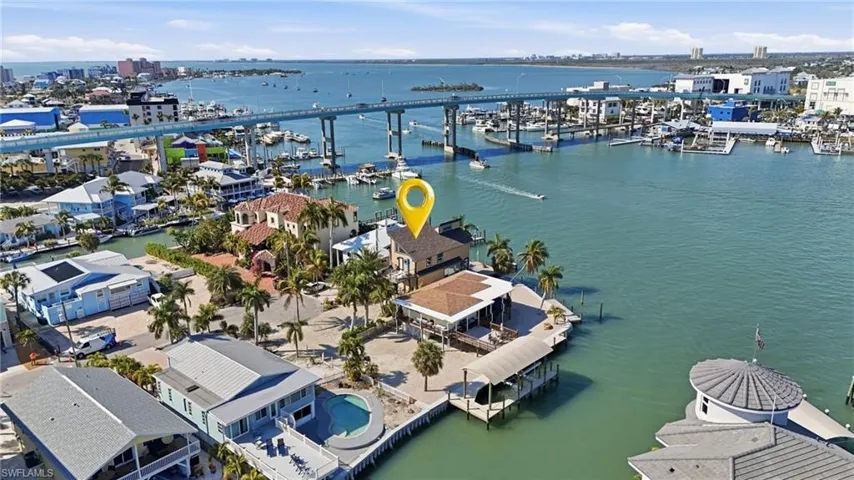 Aerial view of a large body of water and a marina - Virtually Edited Image