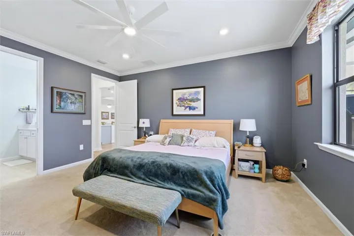 Bedroom featuring crown molding, a multi-blade ceiling fan, recessed lighting, and wall-to-wall carpeting