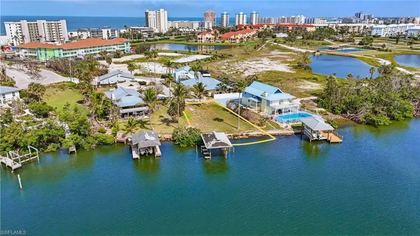 View of urban area featuring a nearby body of water-  VIRTUALLY ENHANCED