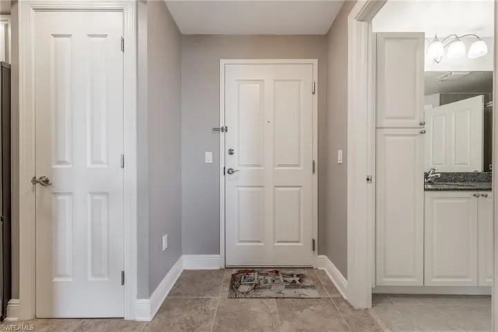 Entrance foyer featuring baseboards
