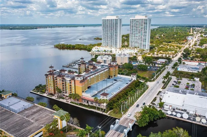View of urban area with a large body of water and apartment complex