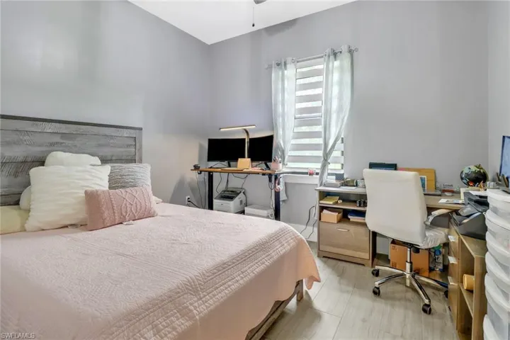 Bedroom with light hardwood / wood-style floors