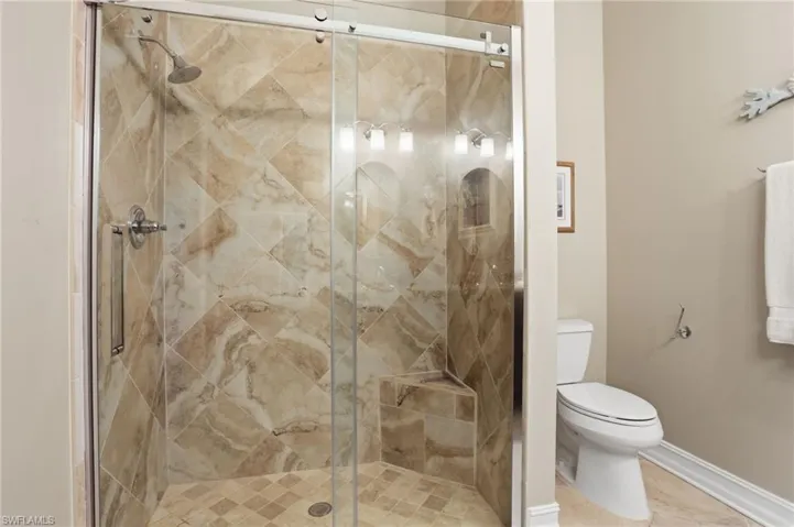Bathroom with toilet and a shower stall