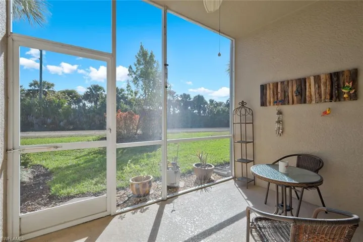 Sunroom featuring a ceiling fan