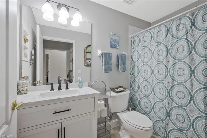 Bathroom with vanity and a shower with curtain