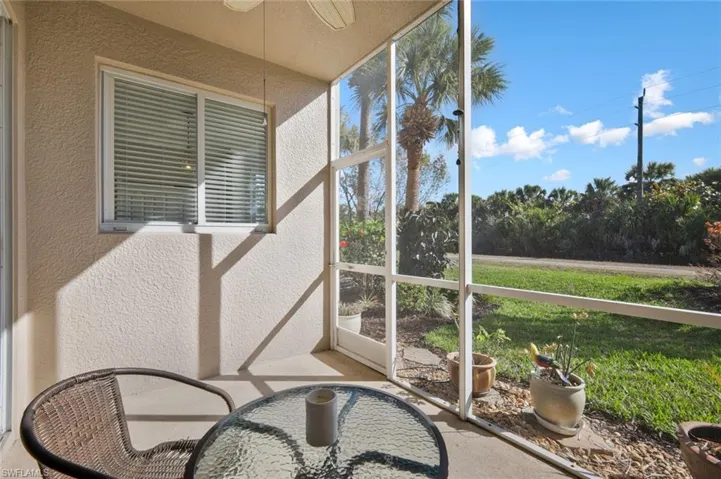 Sunroom featuring a ceiling fan