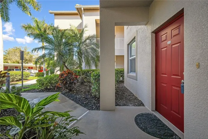 View of exterior entry featuring stucco siding