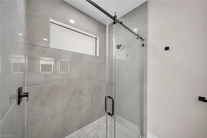Full bathroom featuring a stall shower