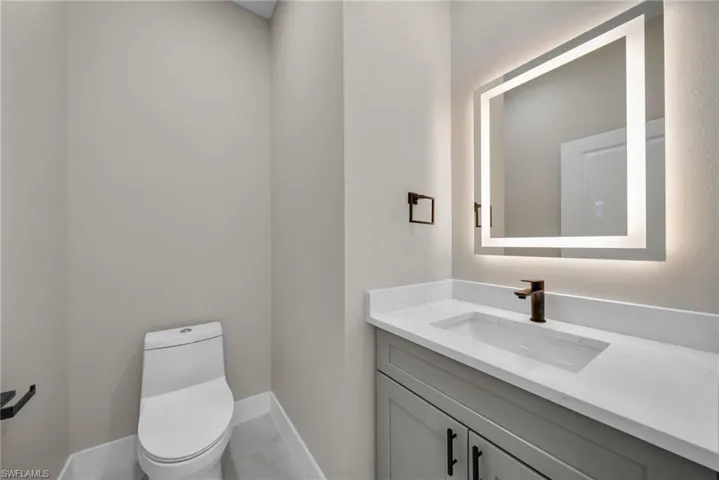 Bathroom with vanity and toilet