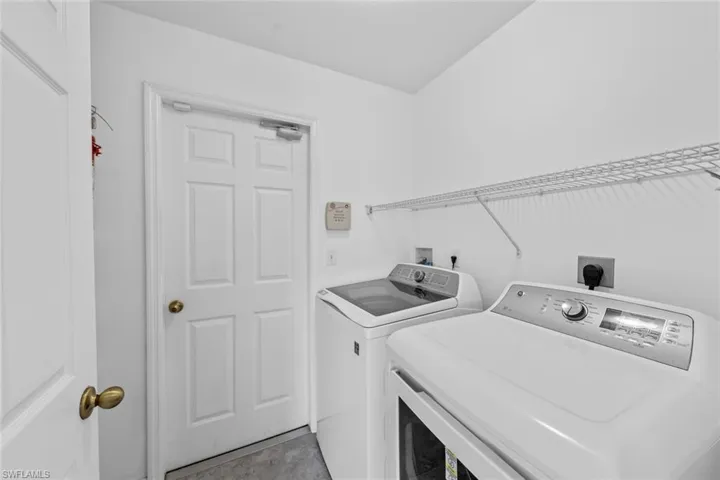 Washroom with washing machine and dryer