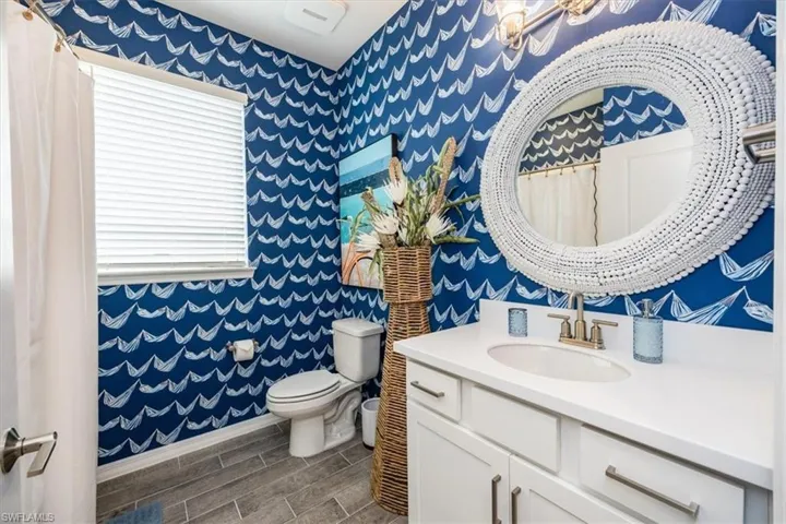 Bathroom with vanity and toilet