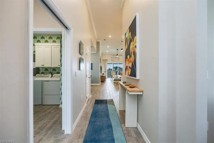 Hallway with washer and dryer