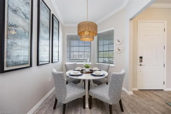 Dining area featuring ornamental molding