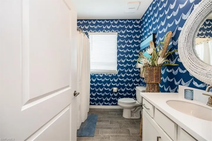 Bathroom with vanity and toilet