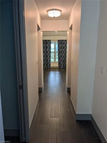 Hall featuring dark hardwood / wood-style floors