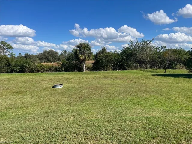 View of yard with a rural view