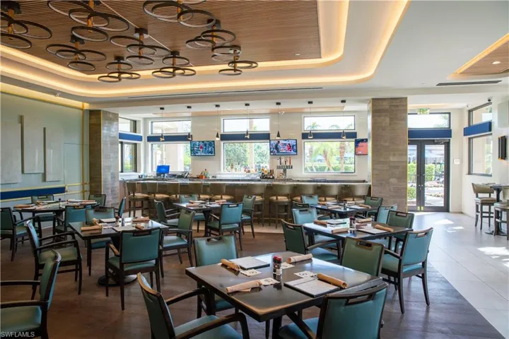 Dining space featuring a raised ceiling and french doors