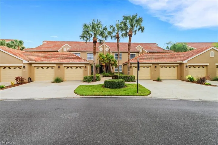 Mediterranean / spanish house featuring stucco siding, a tiled roof, and concrete driveway