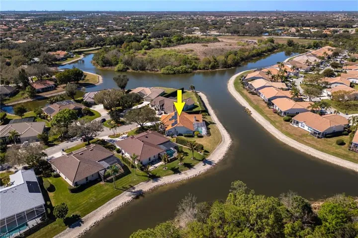 Aerial perspective of suburban area with a large body of water