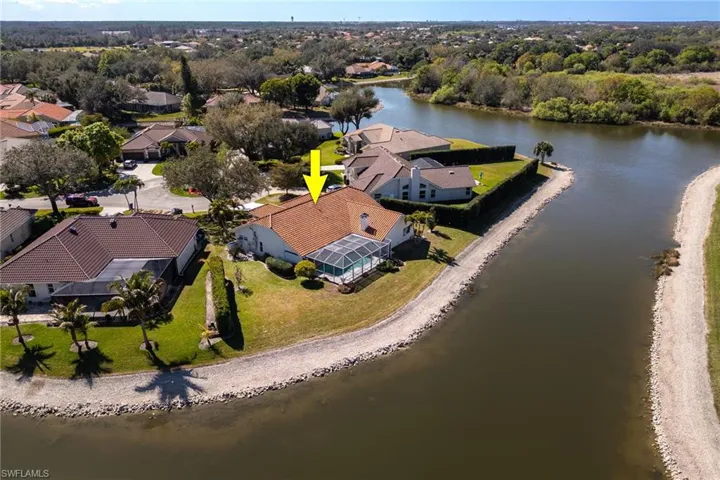 Aerial perspective of suburban area with a large body of water