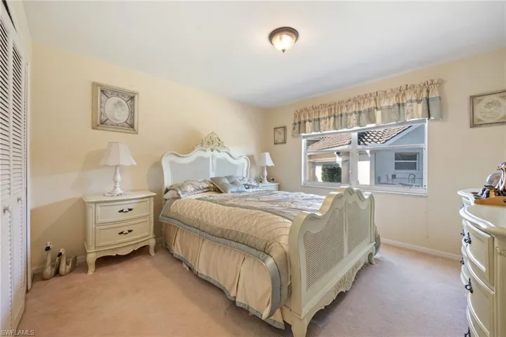 Guest Bedroom with a closet and carpet