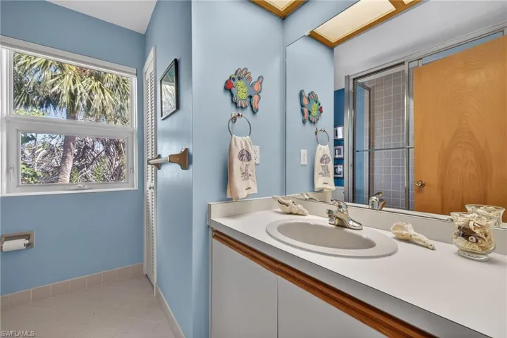Bathroom with vanity and light tile patterned floors