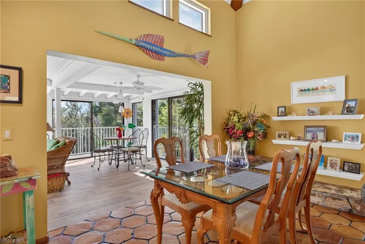 Dining area featuring plenty of natural light, a ceiling fan, and wood finished floors