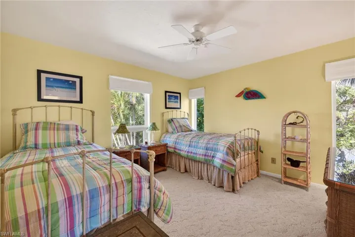 Bedroom with carpet and a ceiling fan