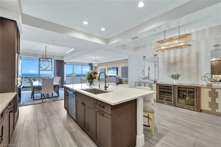 Spacious kitchen with ample cabinetry, beautiful backsplash, stainless appliances and gas stove.