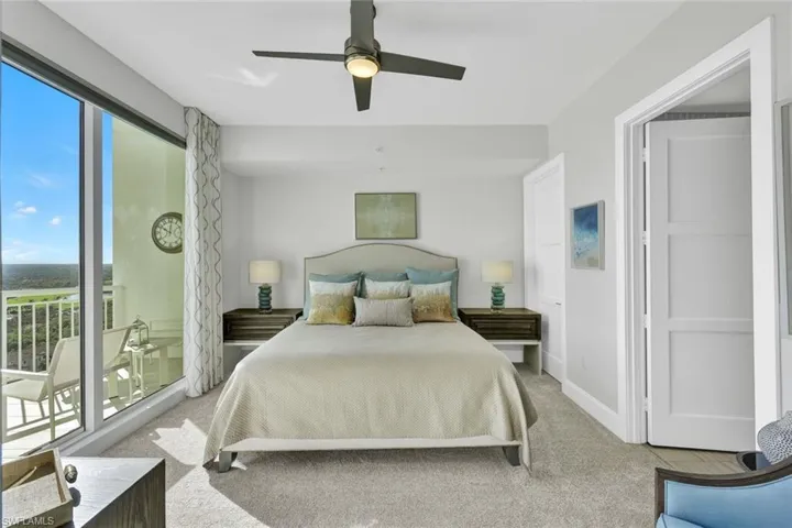 Guest bedroom, located on east side of home, with open balcony and ensuite bathroom.