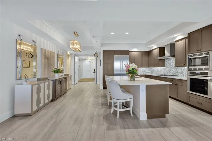 Beautiful wood cabinetry and custom lighting complement this space.