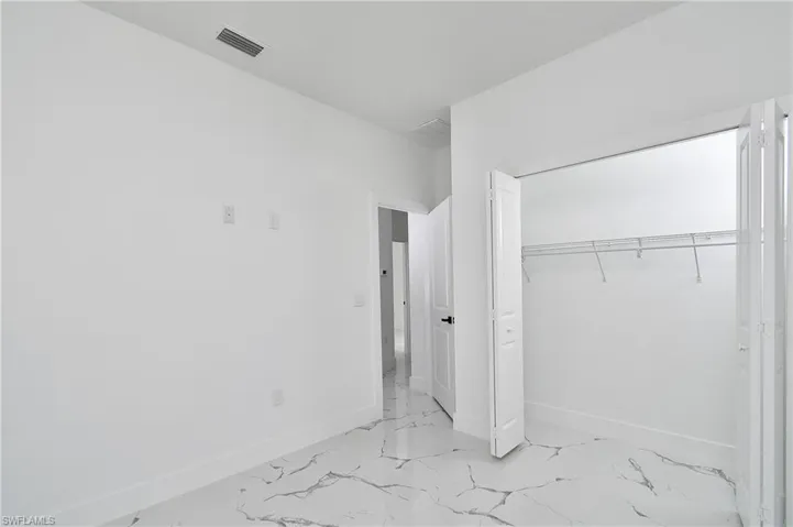 Unfurnished bedroom featuring a closet
