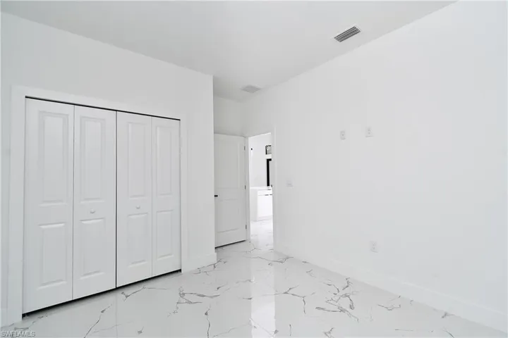 Unfurnished bedroom featuring a closet