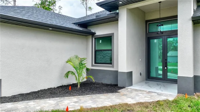 Doorway to property featuring french doors