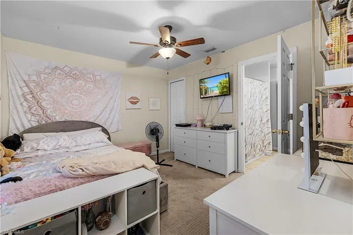 Full bath featuring vanity, tile patterned flooring, and a shower with curtain