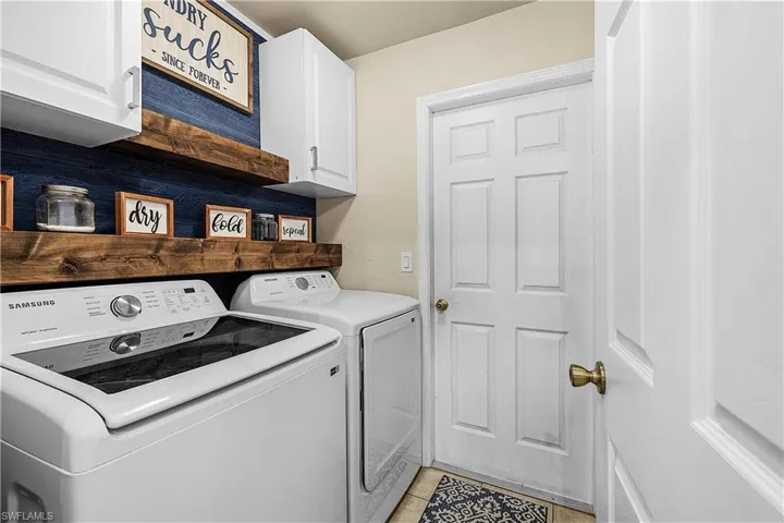 Full bathroom featuring a closet and tile patterned flooring