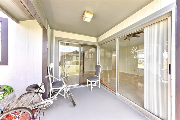 Sunroom with a ceiling fan