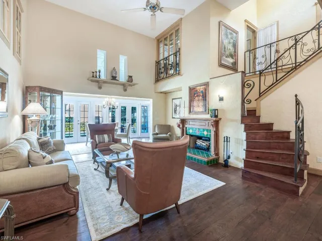 Expansive Living room features a wood-burning fireplace