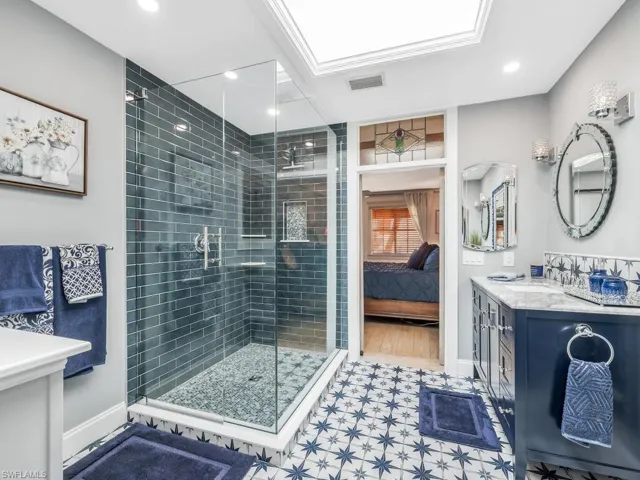 Upstairs Primary Bathroom features a wonderful Skylight and large walk in closet