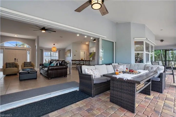 View of patio featuring an outdoor living space and a ceiling fan