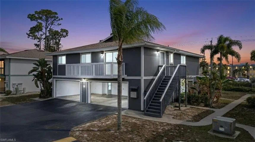 View of front of property featuring driveway and an attached garage