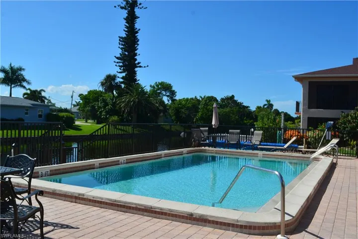 Community pool with a patio area
