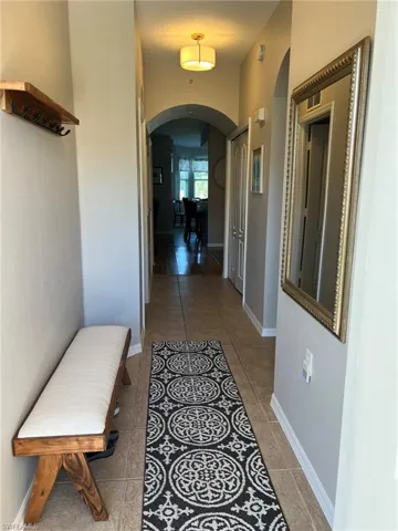 Hall featuring tile floors