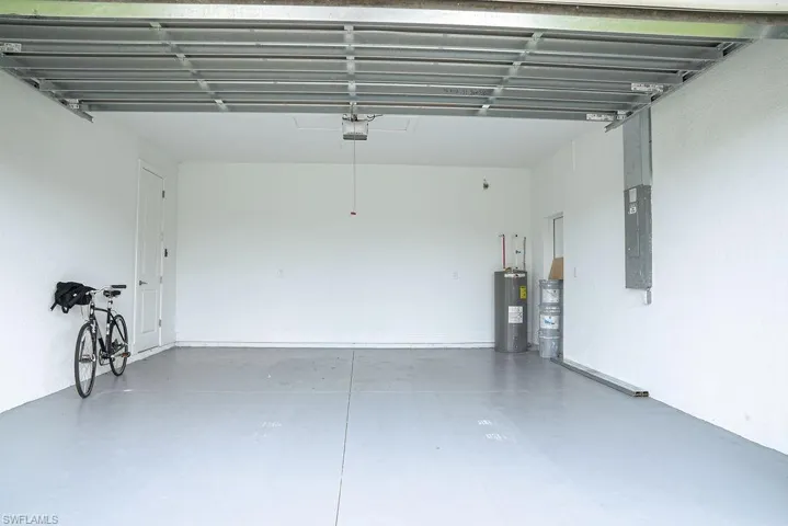 Garage with electric panel and water heater