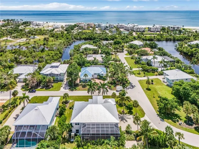Aerial perspective of suburban area with a large body of water