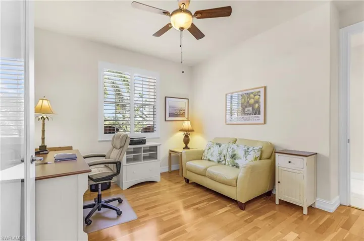Home office featuring light wood-style floors and ceiling fan
