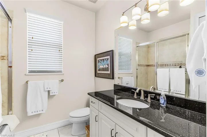 Bathroom featuring vanity and light tile patterned flooring