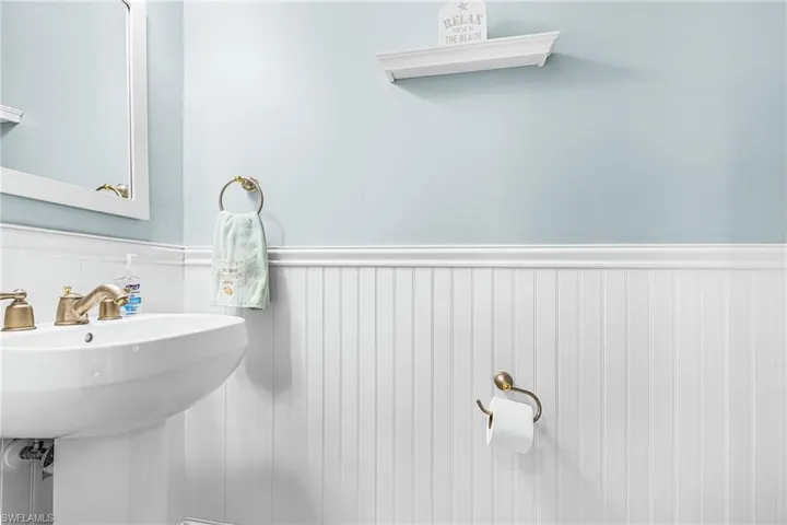Bathroom featuring a wainscoted wall