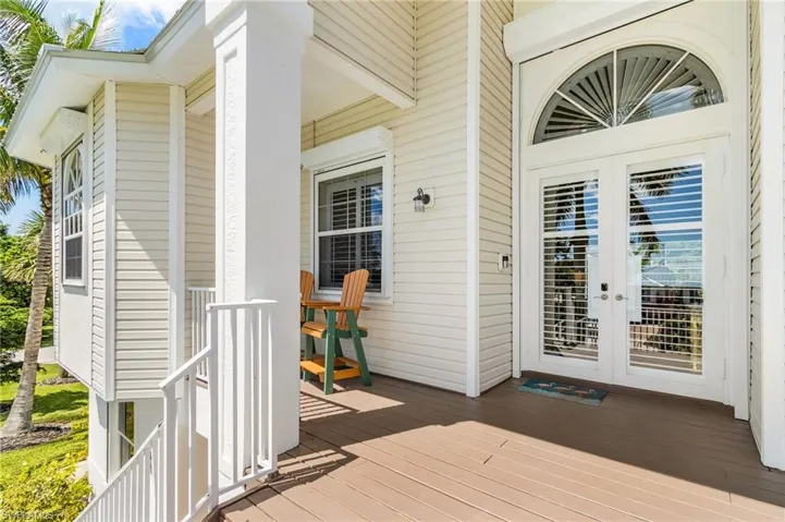 Wooden terrace featuring french doors